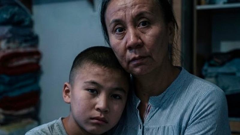 The little boy bites his mother because he is in pain
